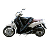 Coprigambe Termoscud®, un coprigambe impermeabile con fodera termica. In uso su scooter. Di TUCANO URBANO.